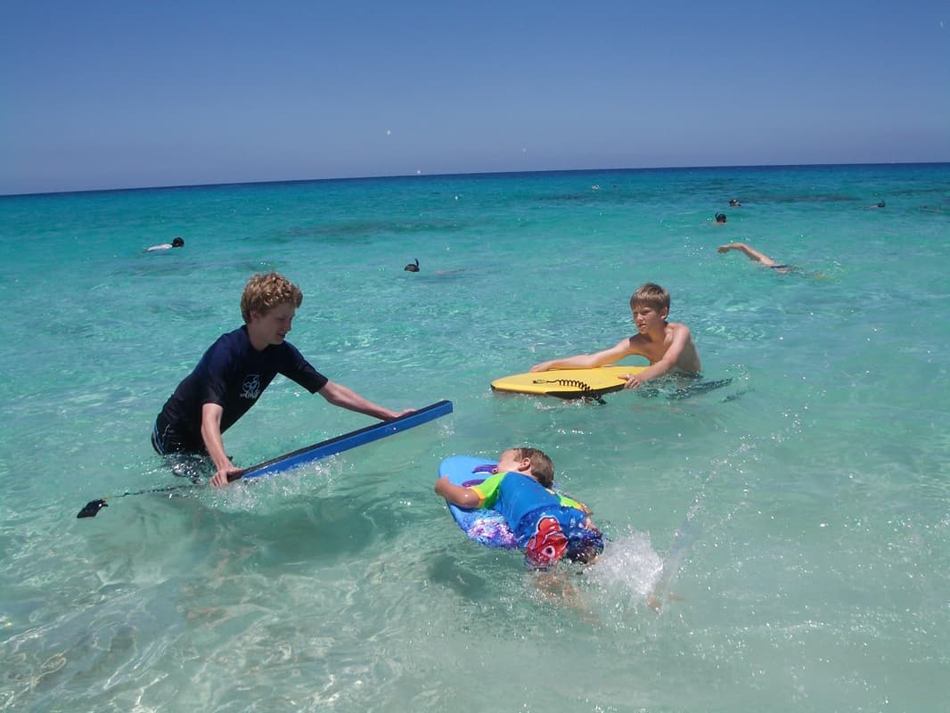 Kids playing in the pristine Kona waters